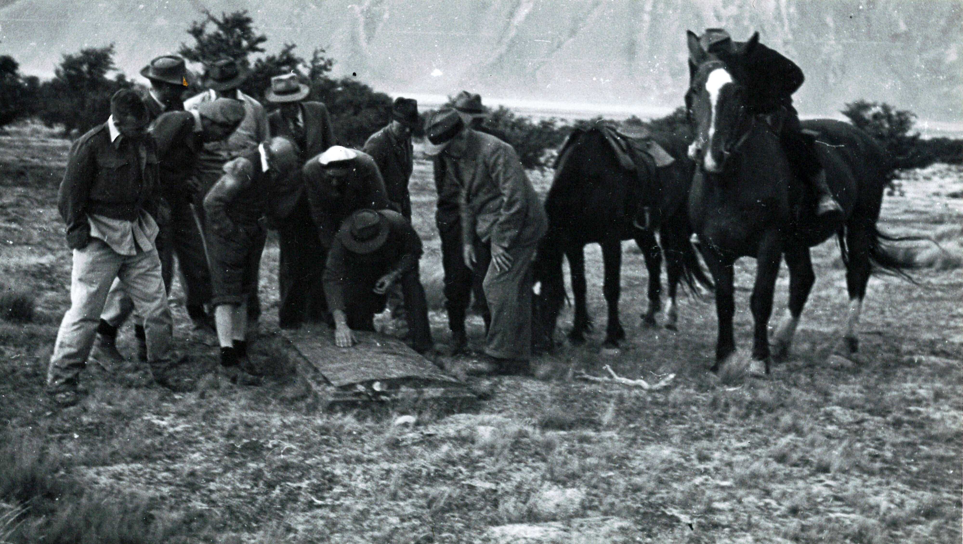 40 The party examines the inscription on Sinclair's grave
