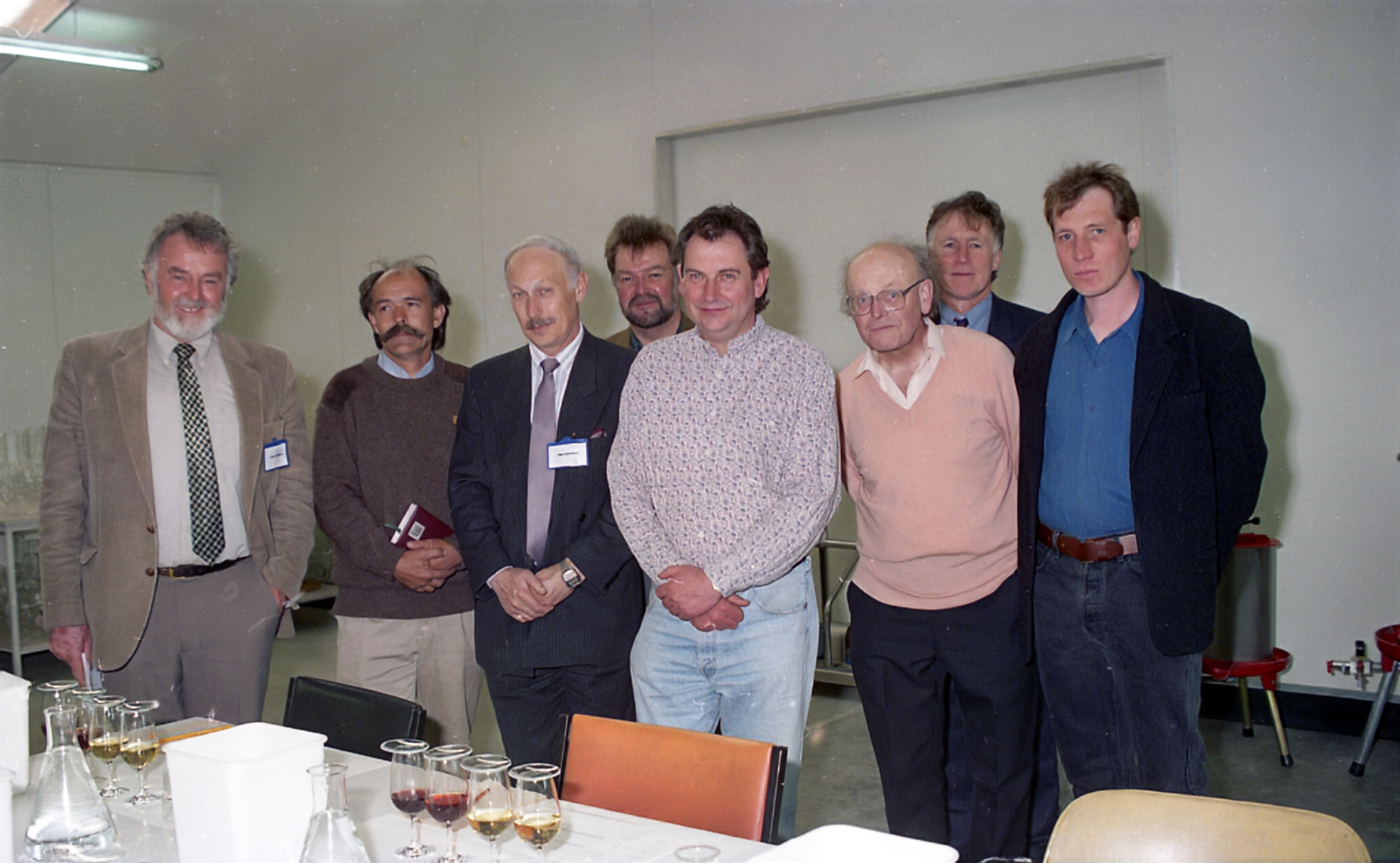 The wine tasting session at the opening of the new Lincoln University winery included
from left, Dr David Heatherbel, Danny Schuster, Prof Ivan Donaldson, Vic Williams, Dennis Farr, Prof
John Lavis, Tim Finn and Rudi Bauer, 1995