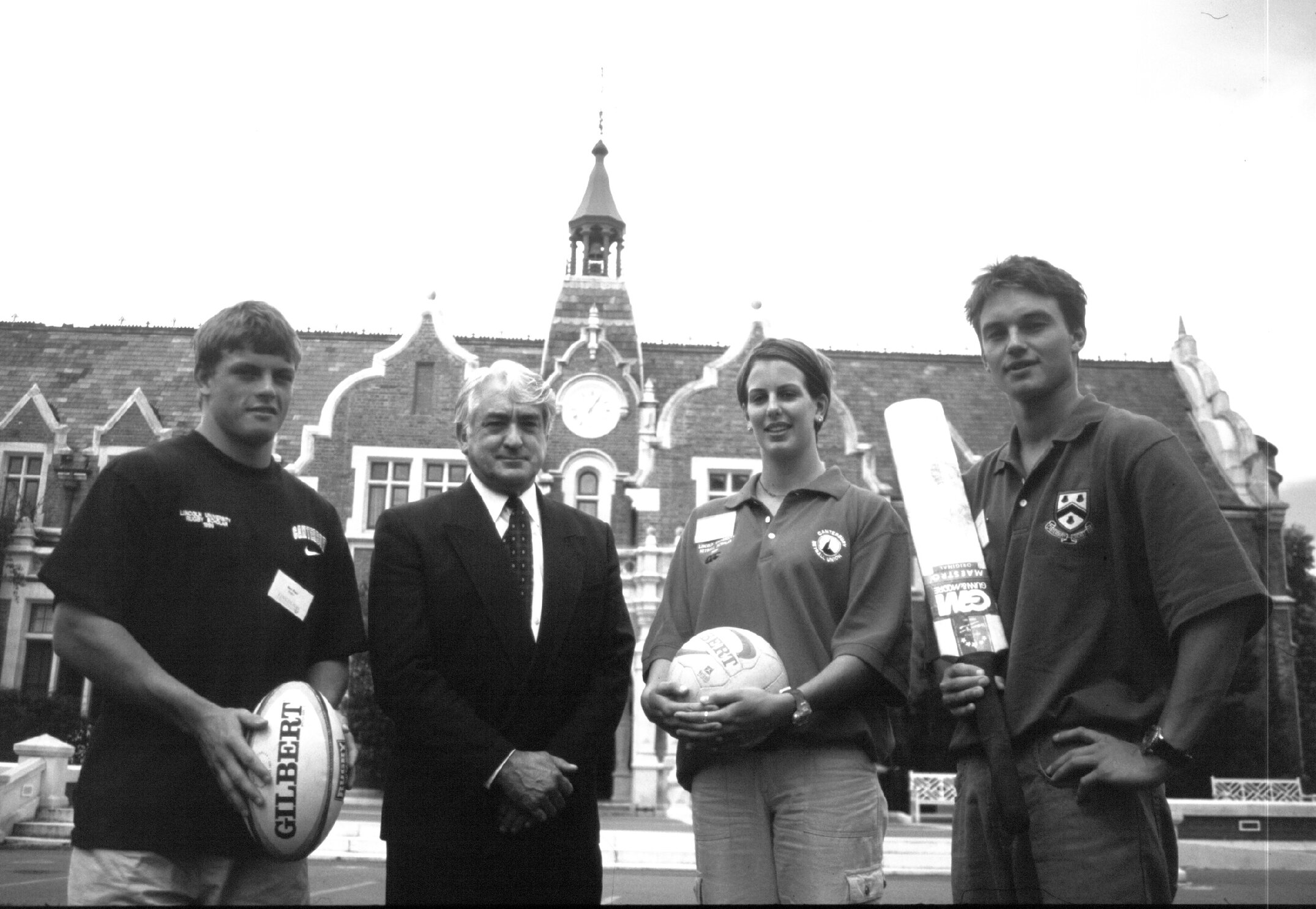 The three sports scholars with Vice-Chancellor Dr Frank Wood. From left, Ben Blair (rugby), Monique Edlin (netball) and Kyle Earnshaw (cricket), 1999
