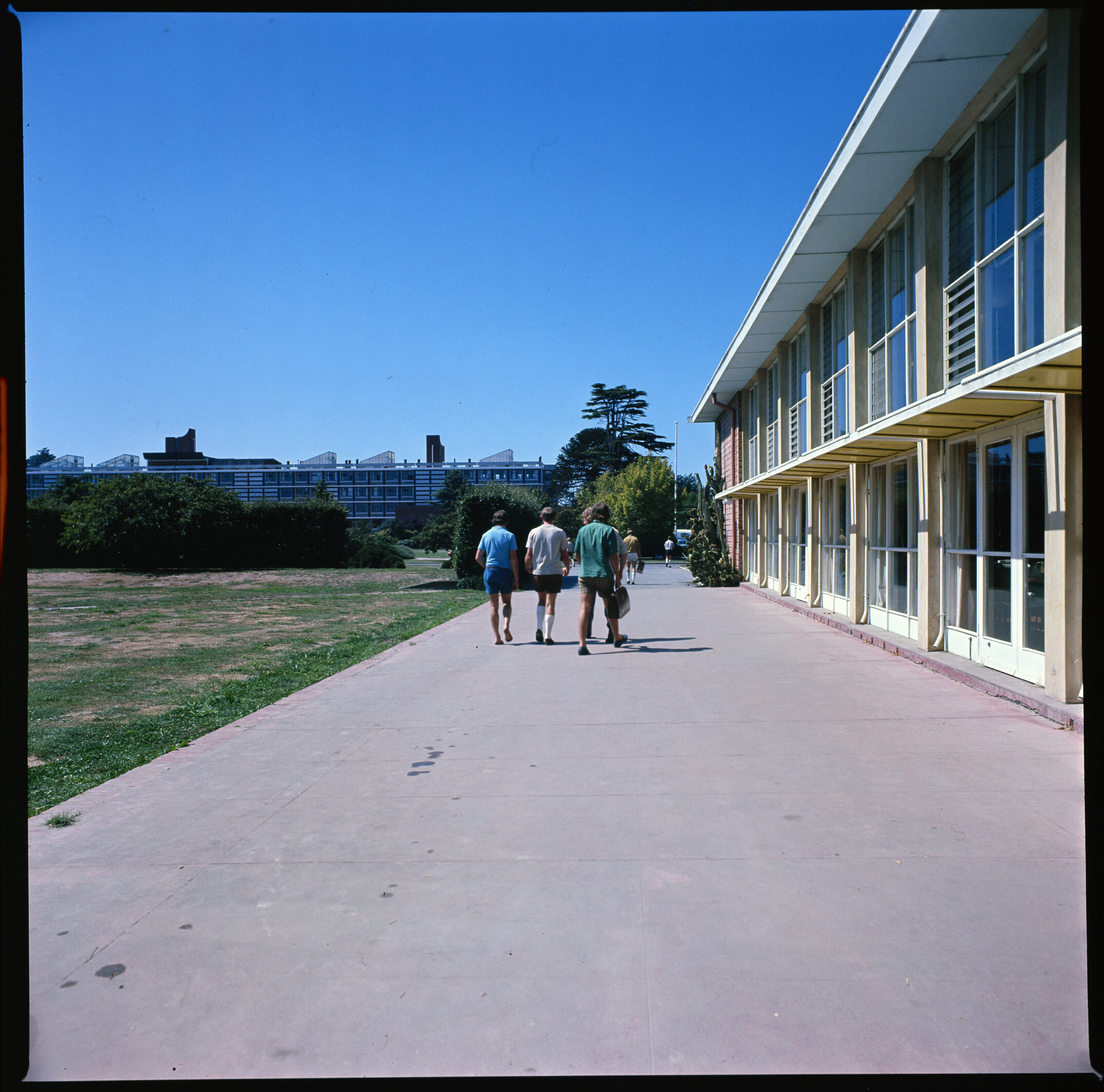 Lincoln campus during the summer of 1976 with students walking near the Refectory Building