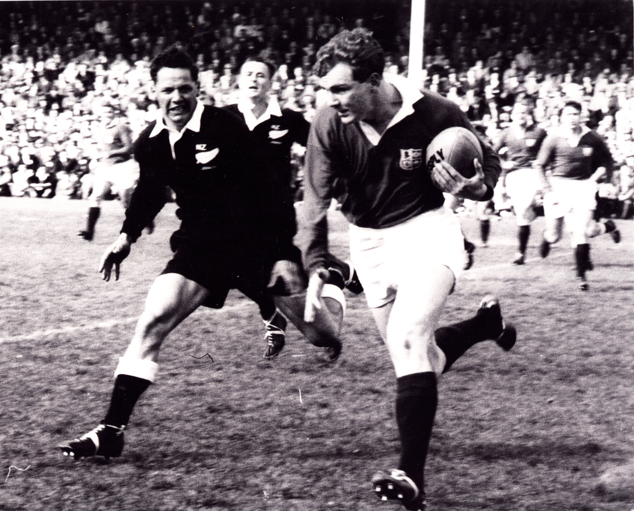 1959 Junior ABs v Lions Don D forces Tony O'Reilly over the sideline before Jeff Butter field broke in.