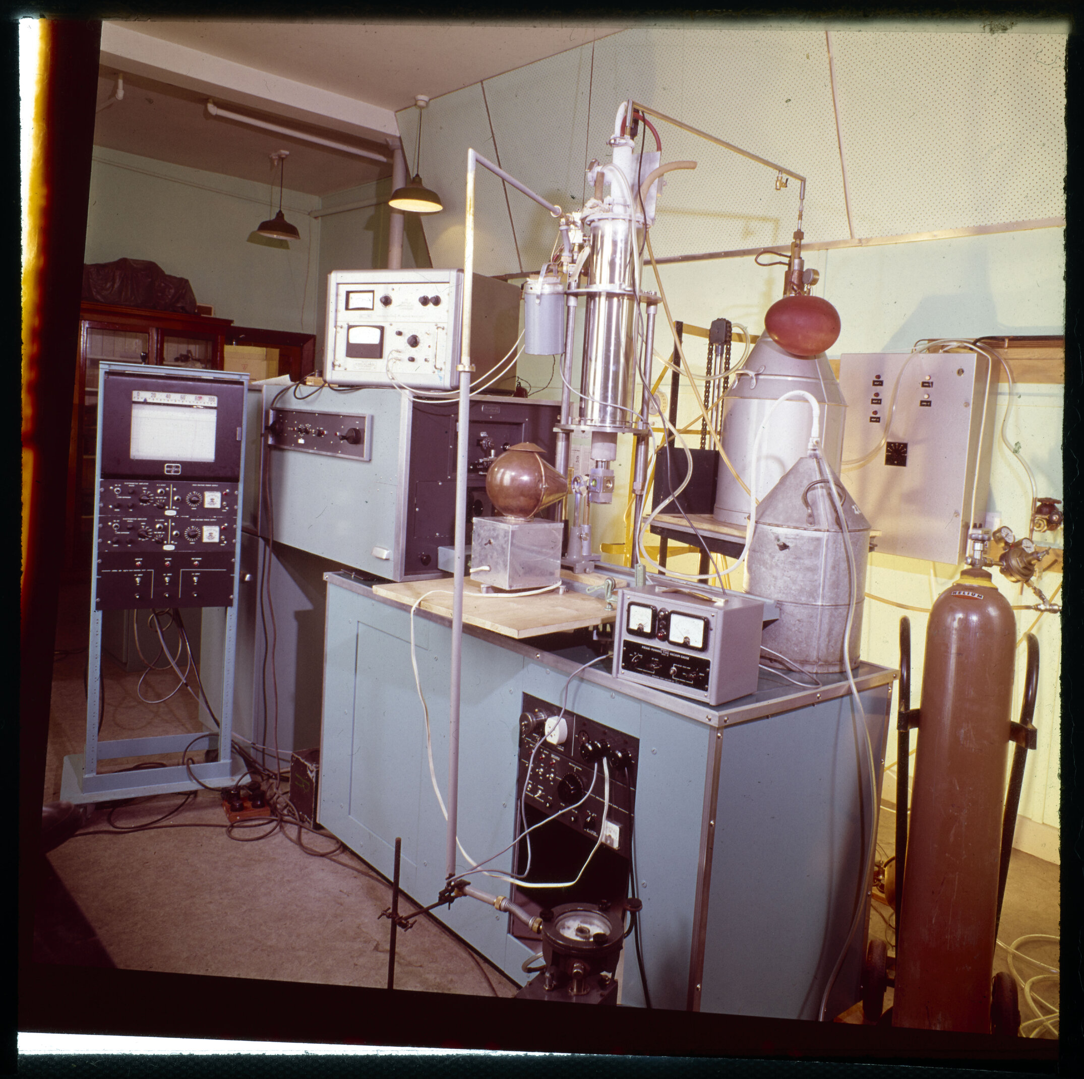 A scientific laboratory setup, most likely a transmission electron microscope (TEM), 1960s to early 1970s