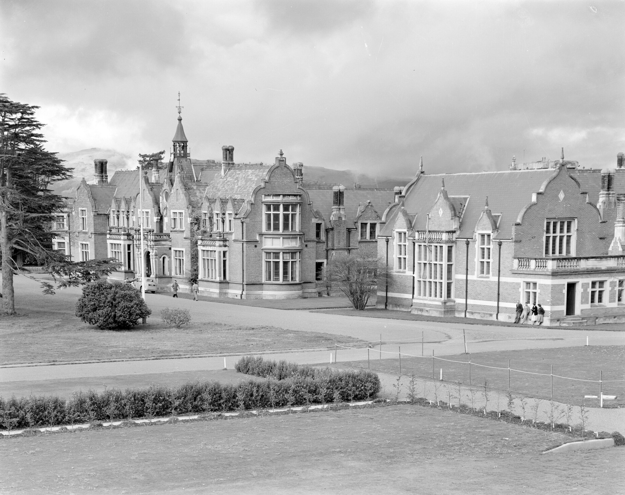 A view of Ivey Hall and Memorial Hall from the Sucken Garden, Canterbury Agricultural College, circa late 1950s
