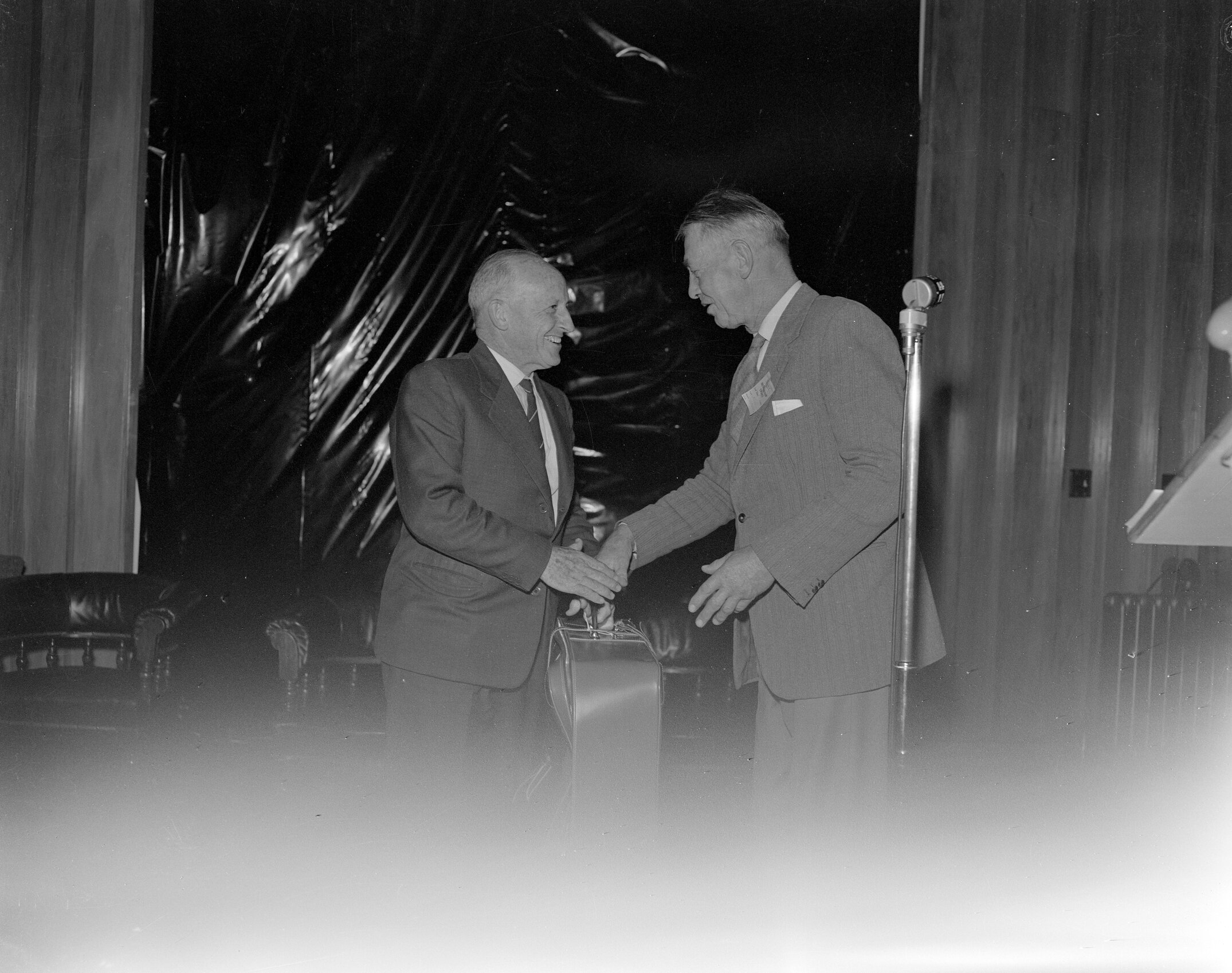 Mr J. Hunt, a committee member and past chairman of the Lincoln College Farmers&rsquo; Conference, making a presentation to Mr L. H. McCaskill, Secretary of the Conference, 1961