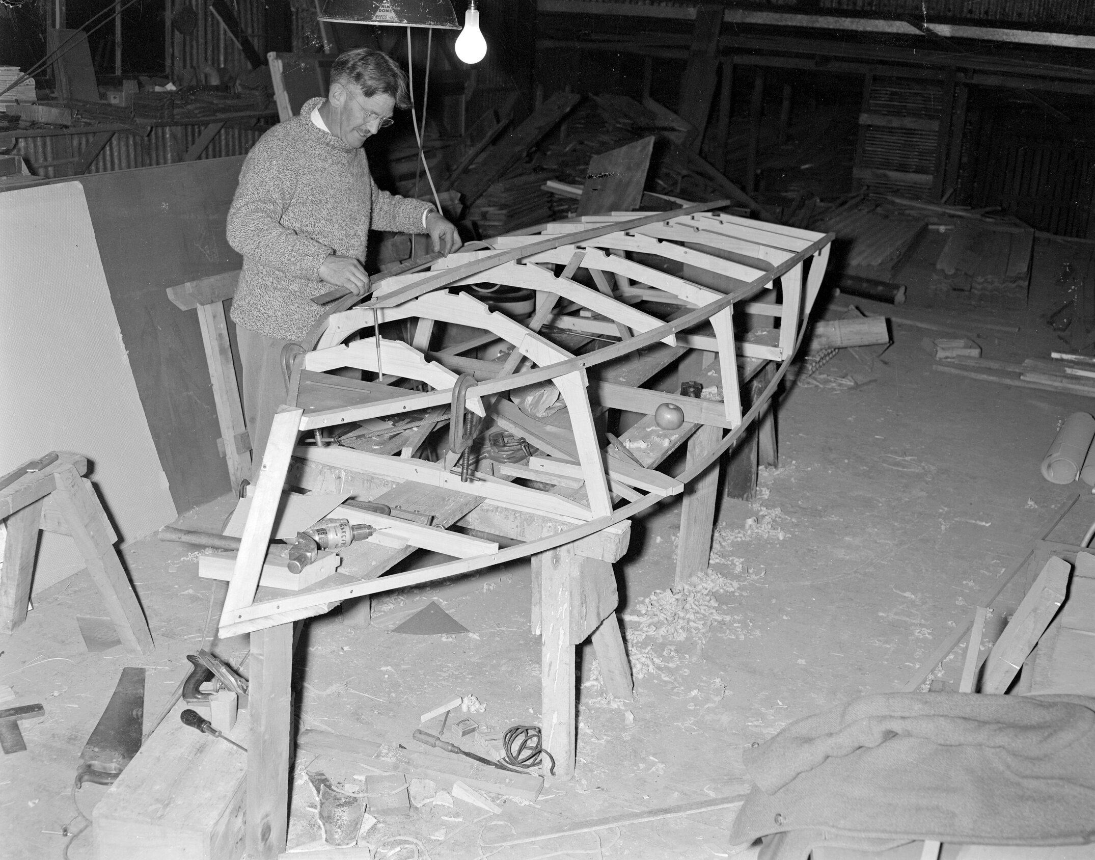 Ron Blackmore constructing a wooden boat frame (Blackmore Neg 5181)