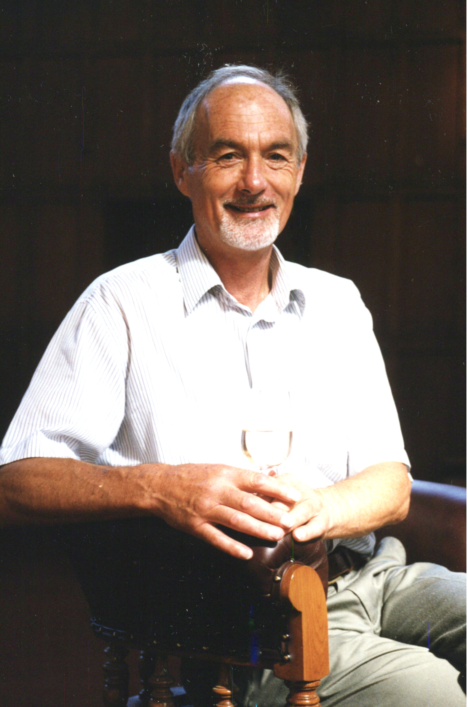 Dr David Jackson, seated in the Gillespie Council Chair with a glass of wine, Memorial Hall, Lincoln University, March 1999 02