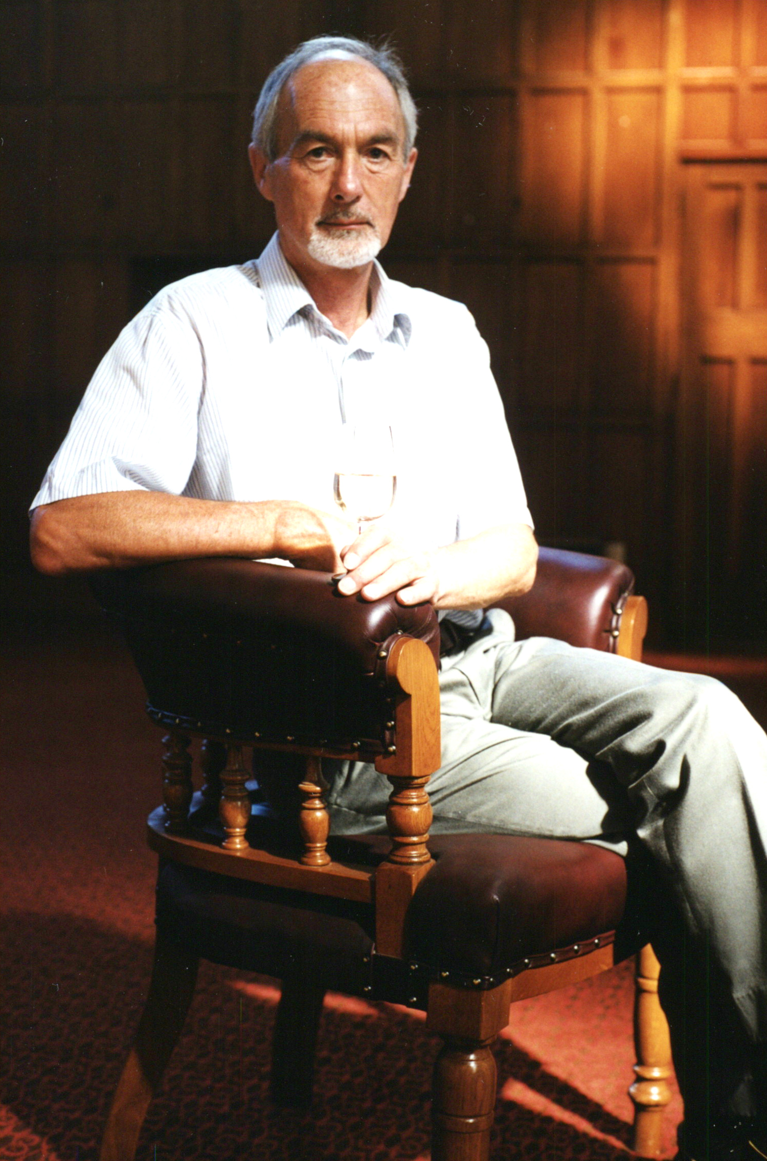 Dr David Jackson, seated in the Gillespie Council Chair with a glass of wine, Memorial Hall, Lincoln University, March 1999 03