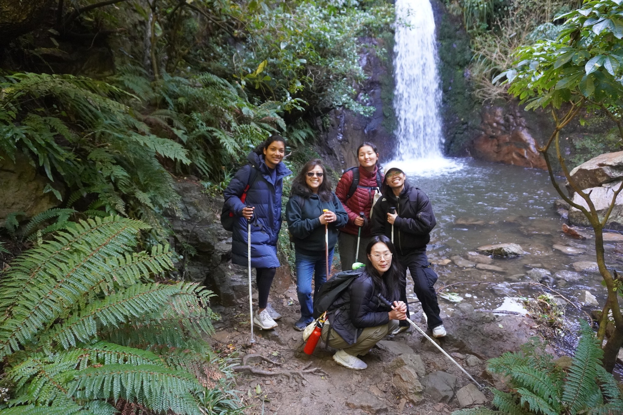 Students pause for a photo at Washpen Falls during a group hike