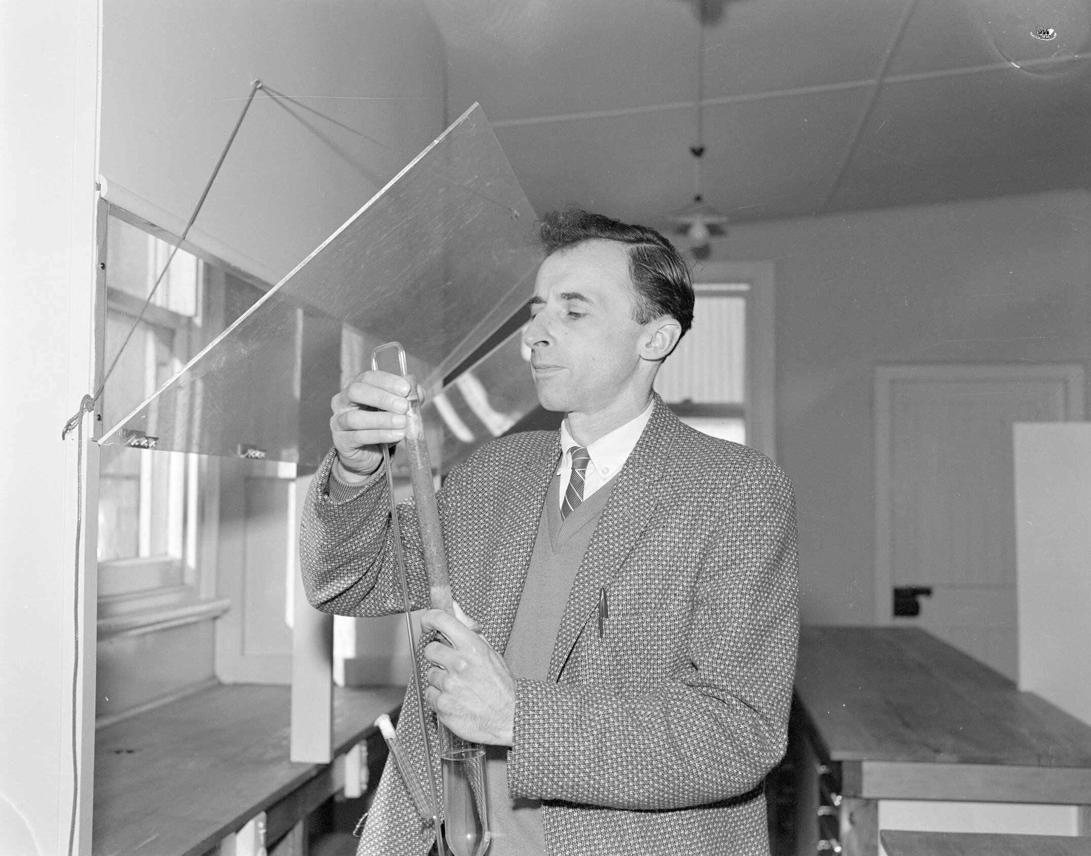 Professor J. B. Robinson setting up a soil perfusion apparatus,1962 (Blackmore Neg 5235)