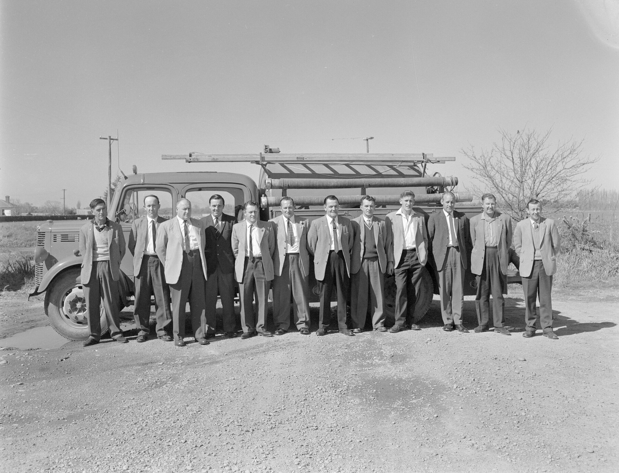 Lincoln college staff admire a Lincoln fire engine, 1960s (Blackmore Neg 5954)