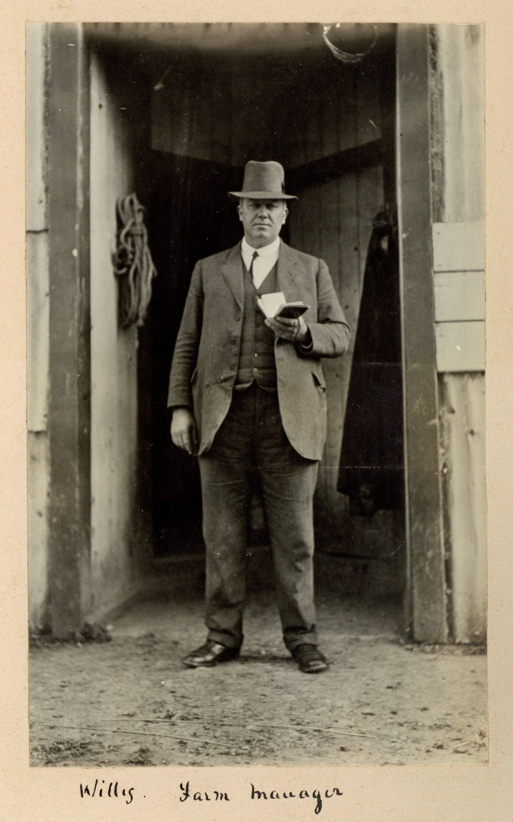 G. A. Willis Standing at the Doorway of a College Farm Building, 1917