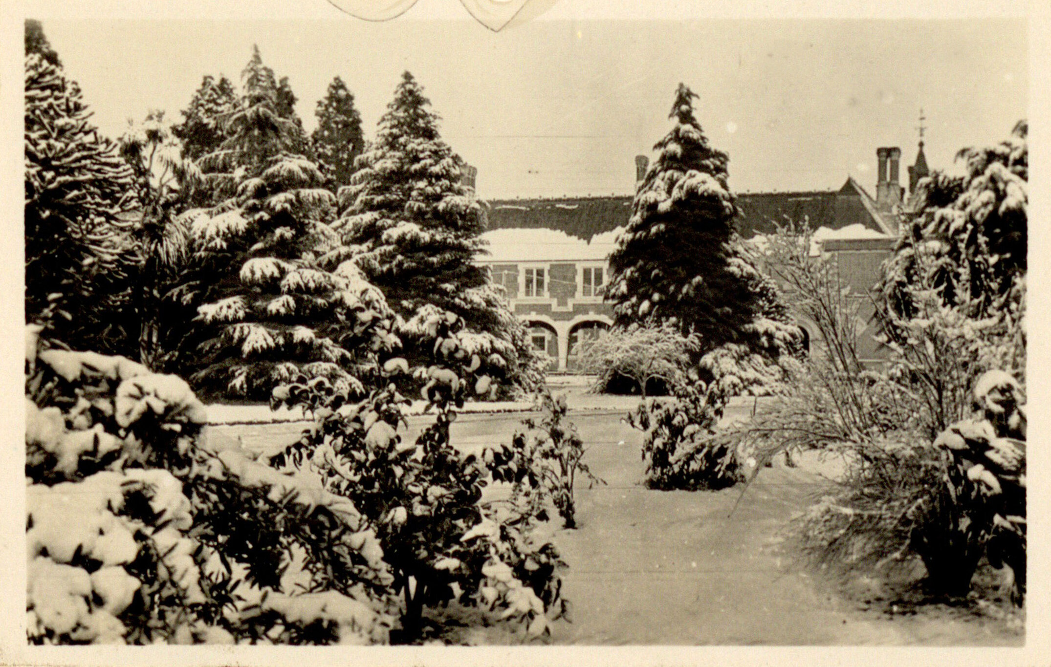 Snow on Canterbury Agricultural College campus with Ivey Hall in the background, June 1918