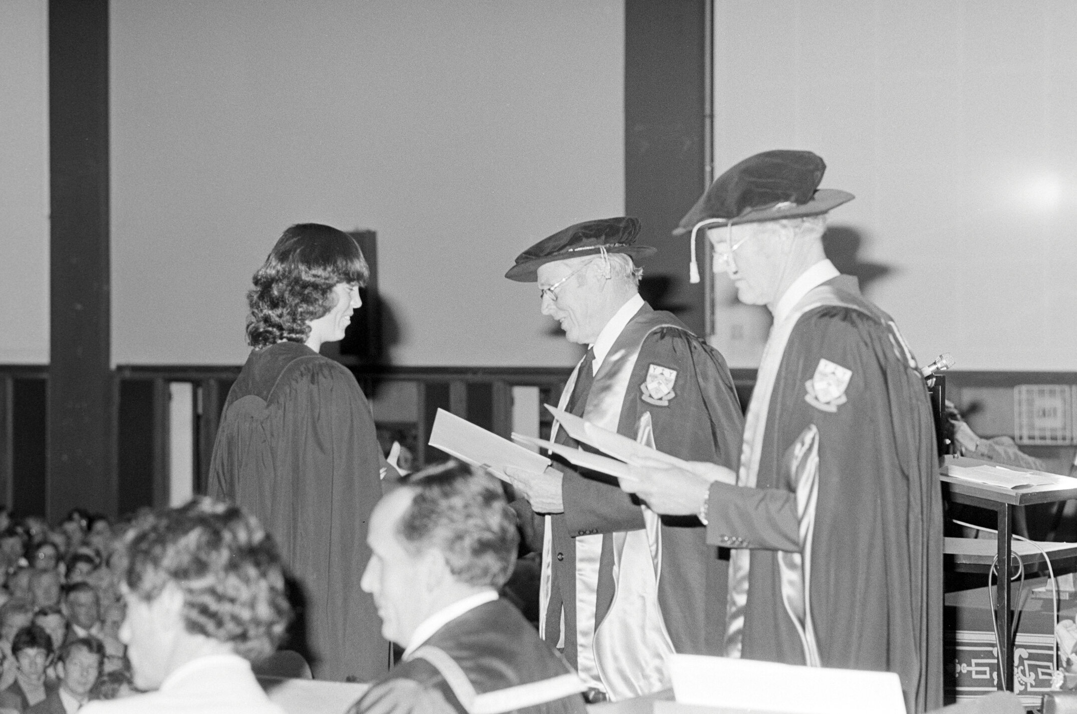 Sidney M. Hurst, Chairman of the College Council Presenting a Degree Certificate at Graduation Ceremony, 1981 04