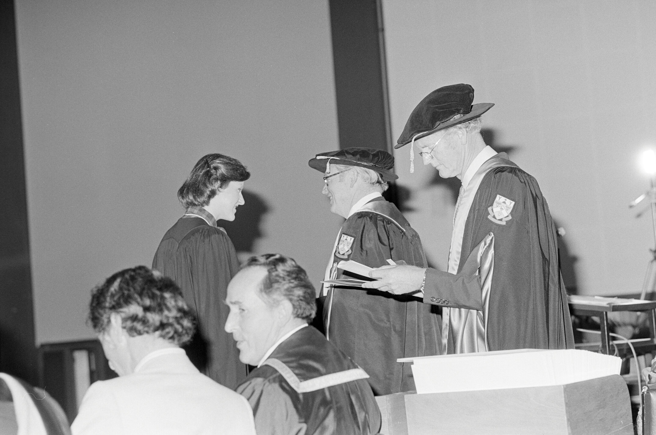 Sidney M. Hurst, Chairman of the College Council Presenting a Degree Certificate at Graduation Ceremony, 1981 02