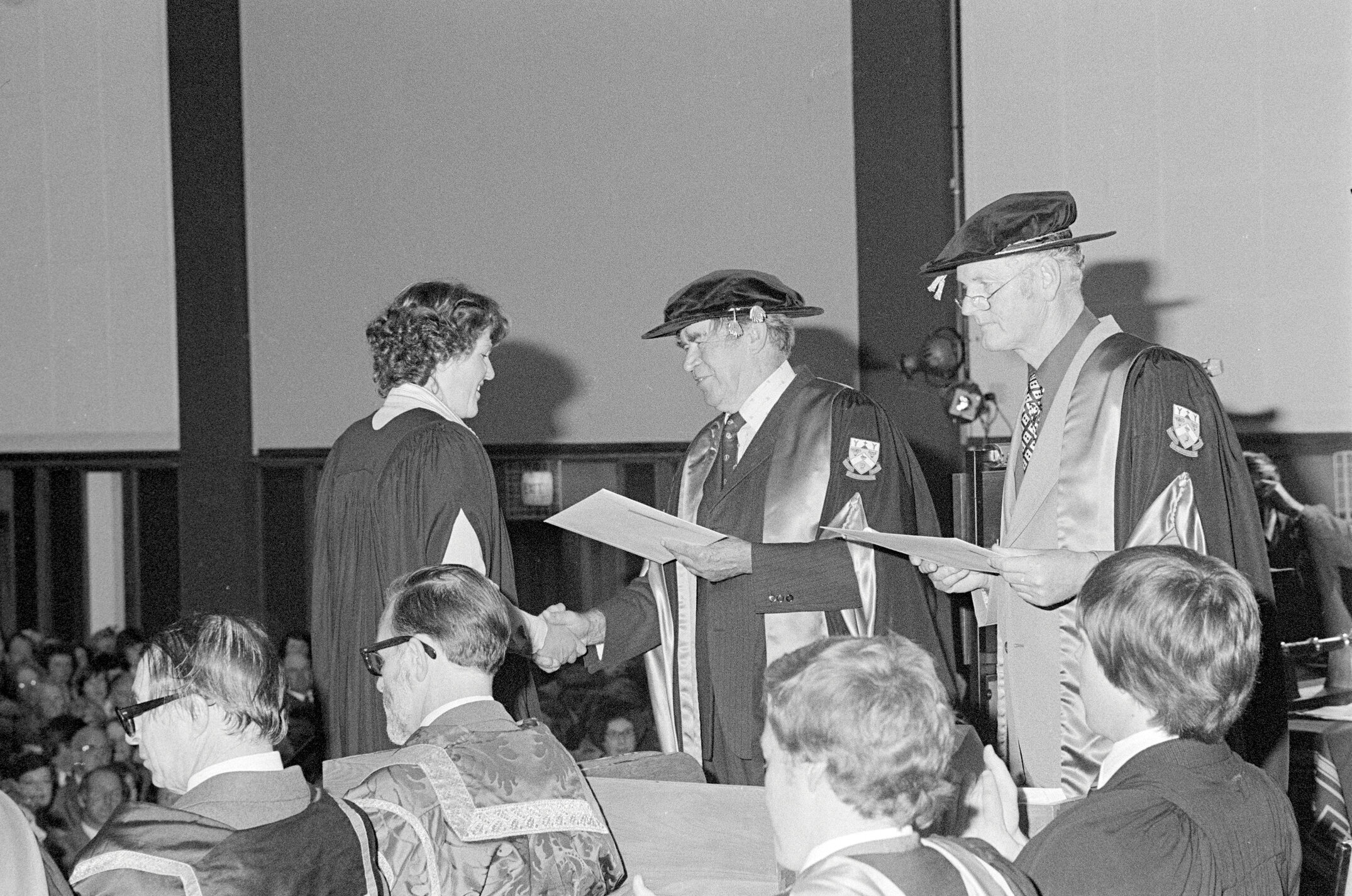 Donald W. Bain, Chairman of the College Council Presenting a Degree Certificate at Graduation Ceremony, 1979