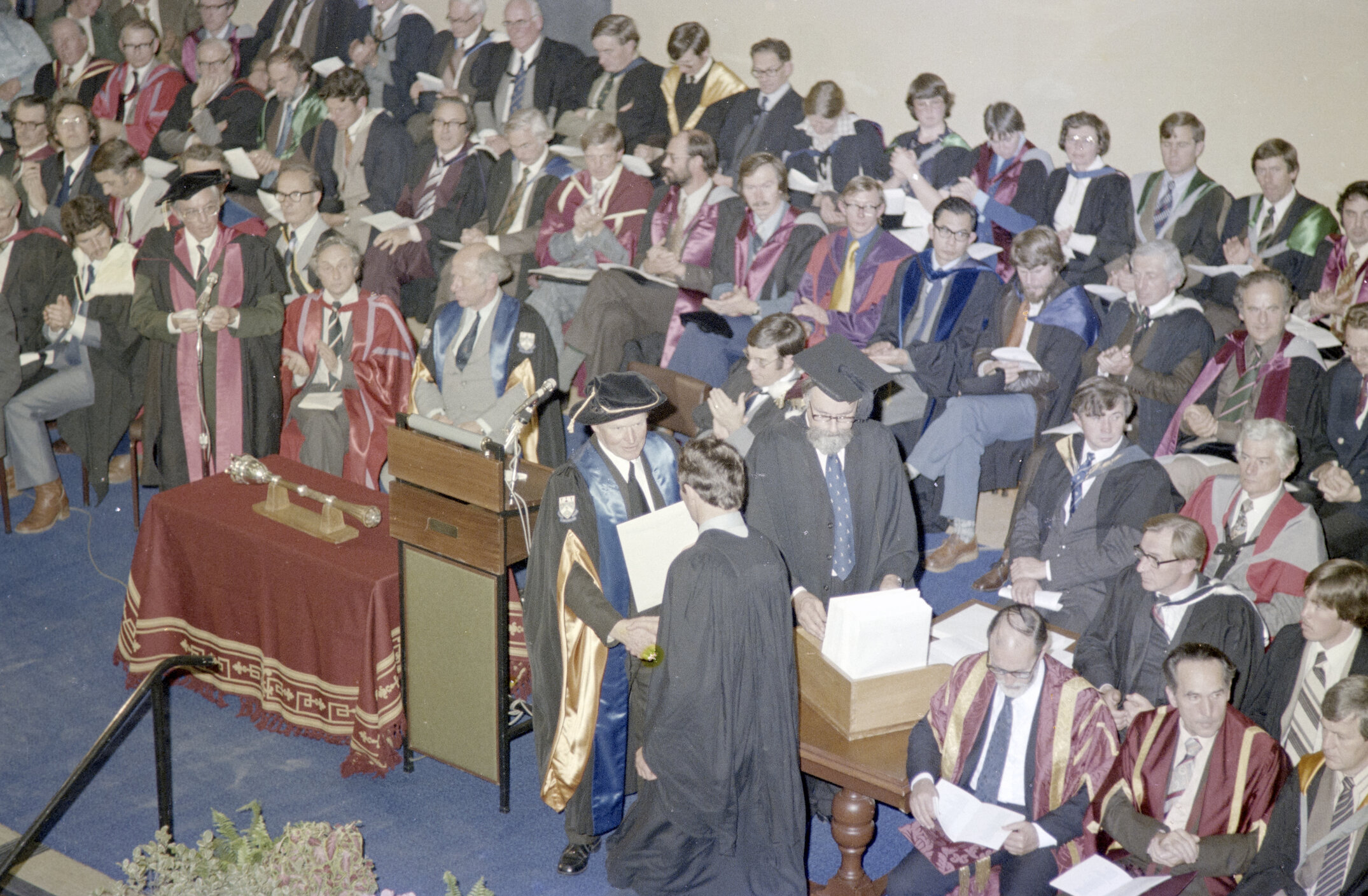 Sidney M. Hurst, Chairman of the College Council Presenting a Degree Certificate at Graduation Ceremony, 09 May 1980