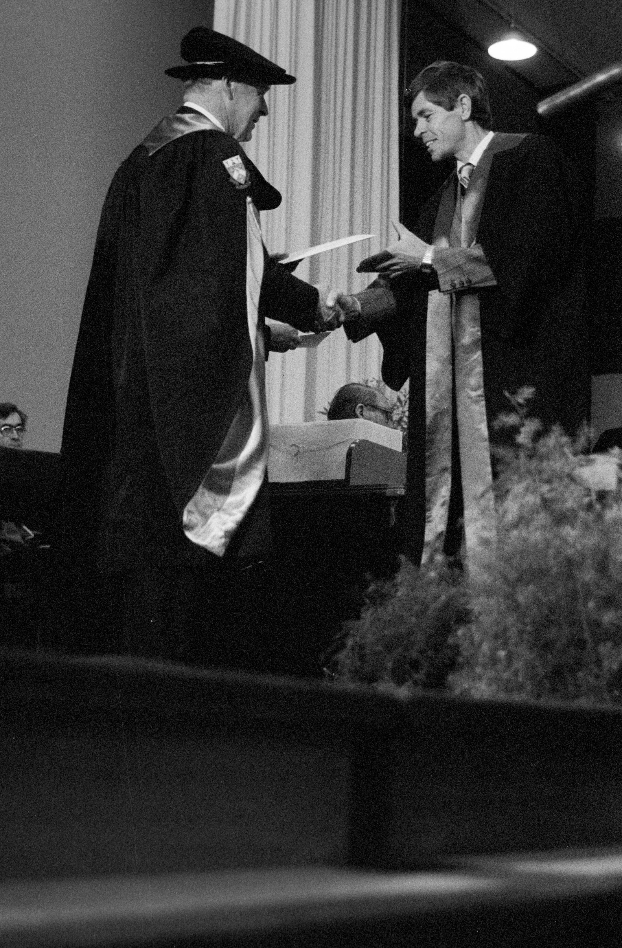 Graduate Awarded Degree Certificate by Sidney M. Hurst in Gillespie Hall, 04 May 1984 02