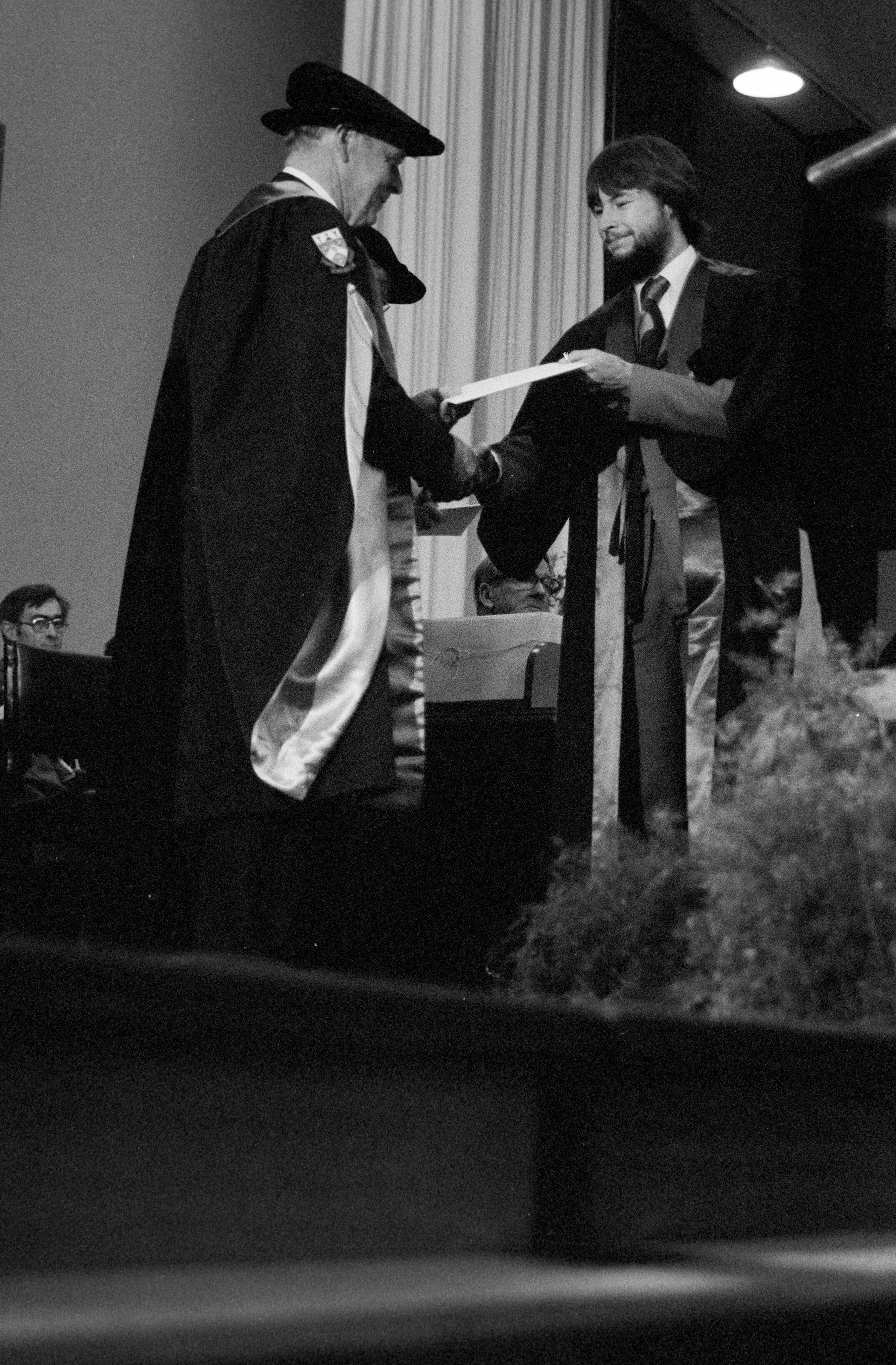 Graduate Awarded Degree Certificate by Sidney M. Hurst in Gillespie Hall, 04 May 1984 03