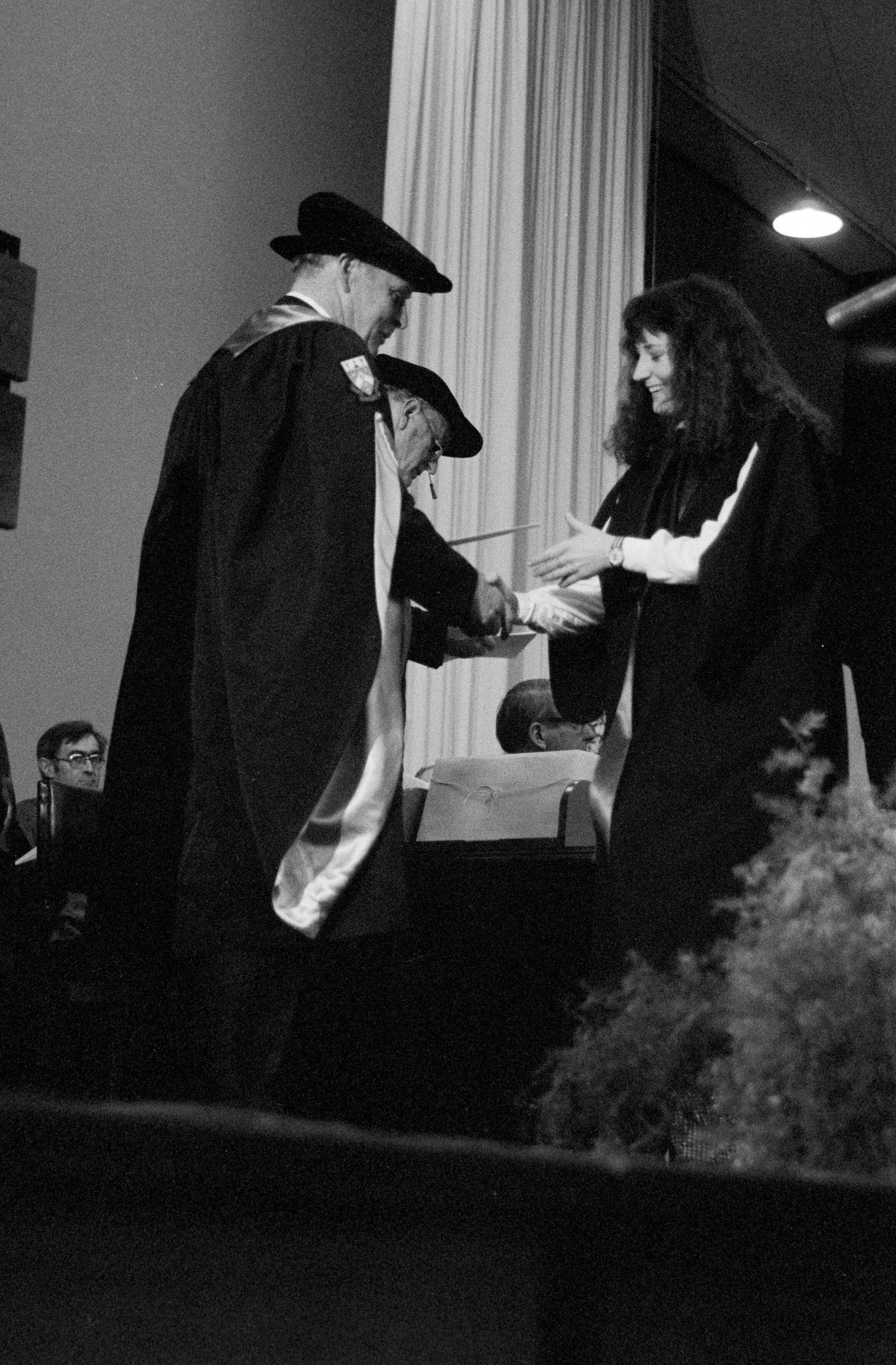 Graduate Awarded Degree Certificate by Sidney M. Hurst in Gillespie Hall, 04 May 1984 04