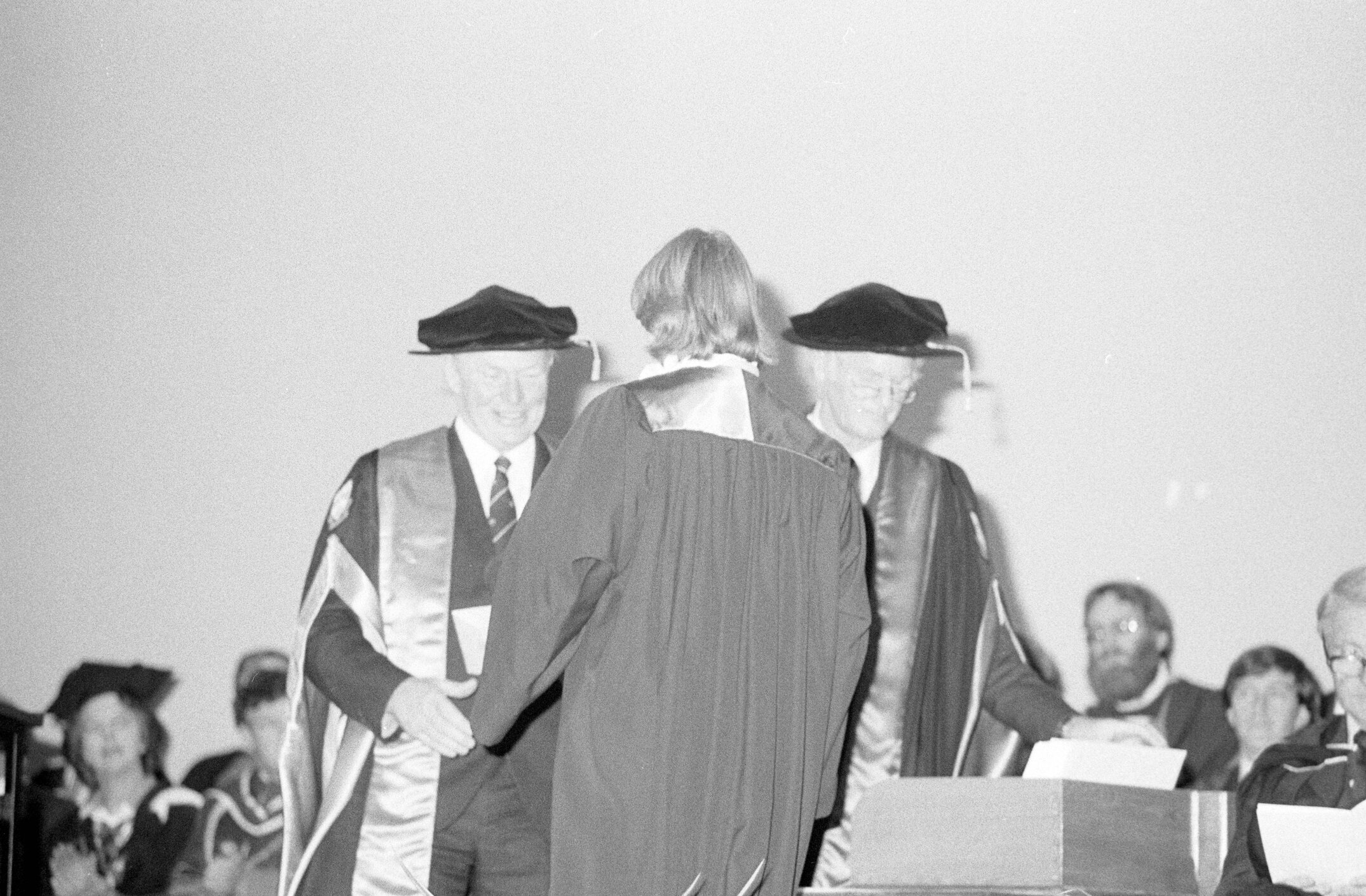Graduate Receiving Degree Certificate from Sidney M. Hurst at the Lincoln College Graduation Ceremony, Gillespie Hall, 04 May 1984 02