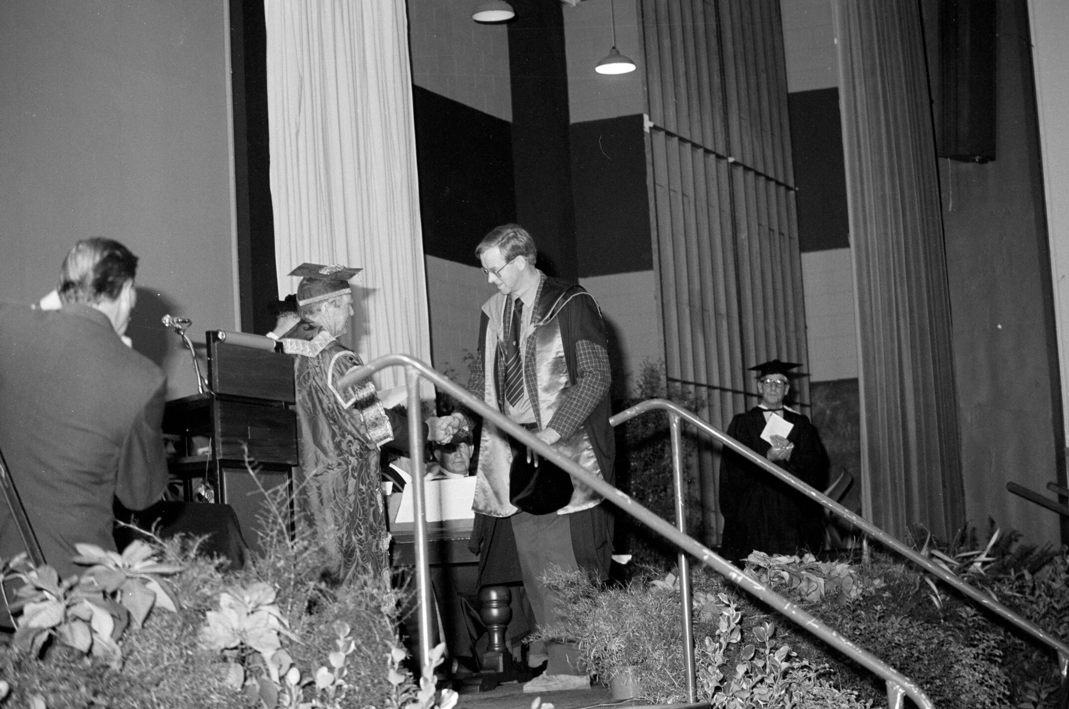 Graduate Receiving Degree Certificate During Lincoln College Graduation Ceremony, Gillespie Hall, 10 May 1985