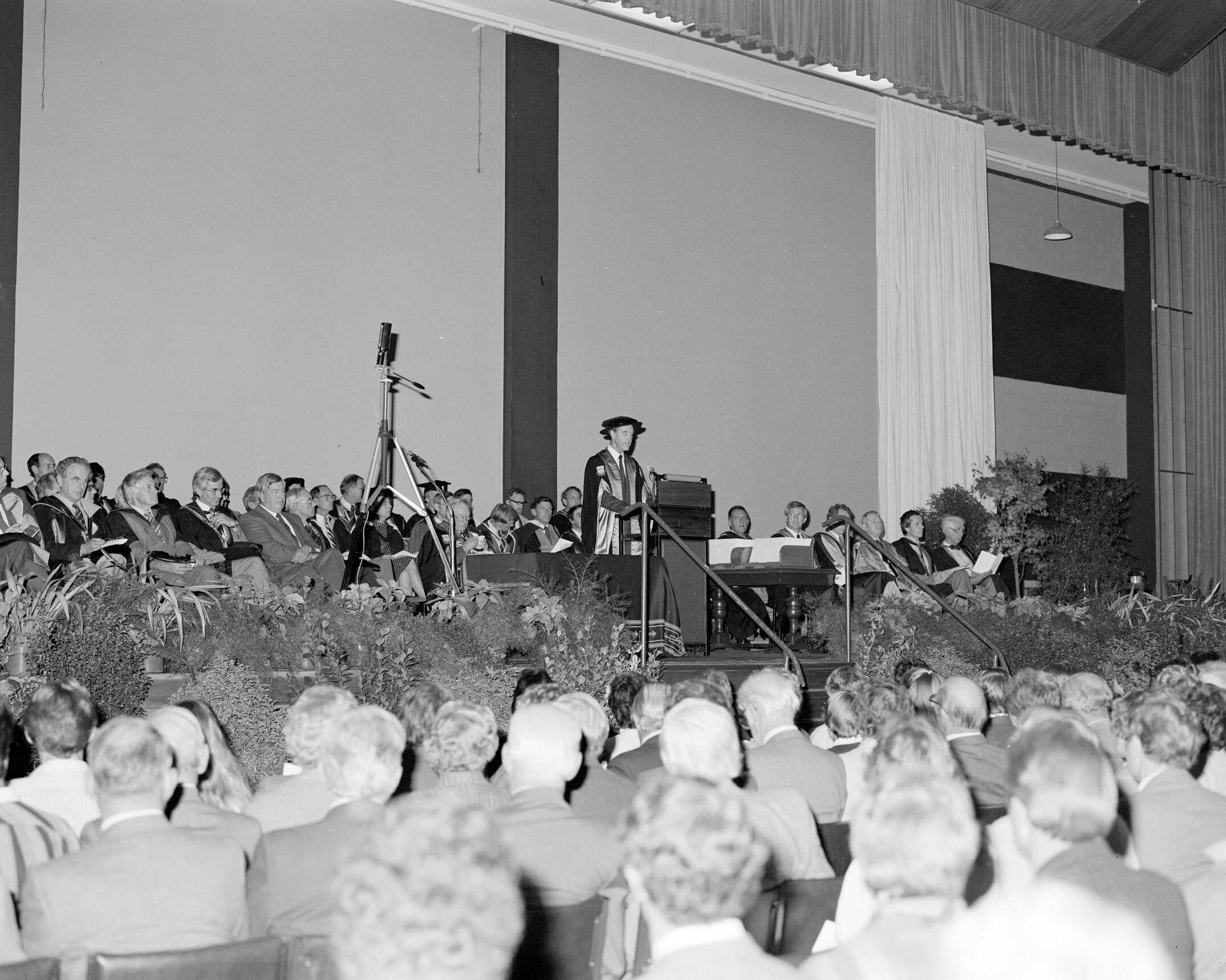 Professor Bruce Ross addressing the attendees at the 1985 Graduation