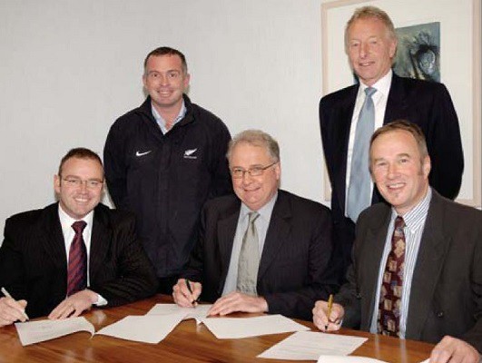 Signing on the line to establish soccer scholarships, from left, Lee Germon, Paul Slack, Professor Roger Field, Geoff Ormandy, Ron Veitch
