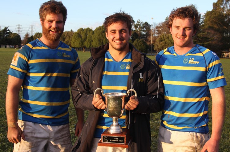 John Borland, left, Nic Souchon and Jesse Houston with the Hawkins Trophy.
