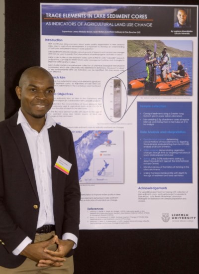 Lughano Mwenibabu with his prize-winning poster on sediment trace metals as indicators of rural land use change in lake cores.