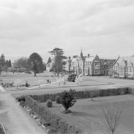 A view of Ivey Hall and Memorial Hall from the Sucken Garden, Canterbury Agricultural College, 1960
