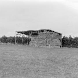 Hay bales stored under open‑sided shelter (Blackmore Neg 5118)