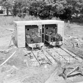 Hudson Hall is supplied with PWD railway locomotives to supply heat and hot water while a permanent boiler house is built (Blackmore Neg 5131)