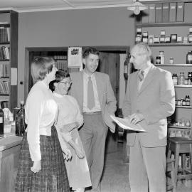 1960s microbiology staff gather in the laboratory (Blackmore Neg 5170)