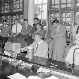 Mr T. M. Morrison demonstrates the use of isotopes to members of a short course in plant physiology 1961 (Blackmore Neg 5173)