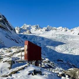 Almer Huts Long drop with Franz Josef Glacier in the background. 