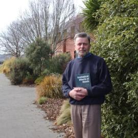 Professor Ian Spellerberg with a copy of Ecological Effects of Roads, photographed on 23 August 2002
