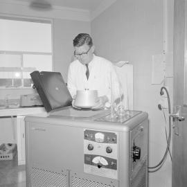 Dr A.J. Wicken demonstrating new laboratory equipment,1964 (Blackmore Neg 5935)