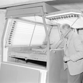 C.E. Iversen uses a growth cabinet, early 1960s (Blackmore Neg 5937)