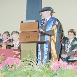 Sidney M. Hurst Addressing Graduates and Guests in Gillespie Hall, 04 May 1984. 