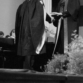 Graduate Receiving Degree Certificate from Sidney M. Hurst at the Lincoln College Graduation Ceremony, Gillespie Hall, 04 May 1984 01