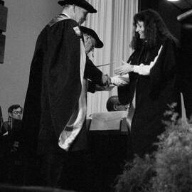 Graduate Awarded Degree Certificate by Sidney M. Hurst in Gillespie Hall, 04 May 1984 04