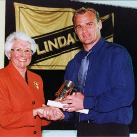 Scott Robertson receives his Lincoln University Sportsperson of the Year Award from Chancellor margaret Austin, September 2000
