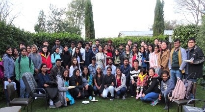 Students from the course gather at a potluck welcoming dinner.