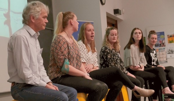 The speakers form a panel to answer audience questions.