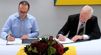 Kuehne + Nagel Senior VP North American Trade, Marcus Reimann, signs the MOU with Lincoln University Acting Vice-Chancellor, Professor Bruce McKenzie.