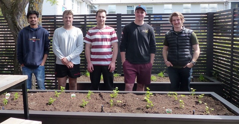 Global Challenge Scholars (from left to right) Darshil Varmora, Shea Lansdown, Hugh Loughnan, Ryan Napper, and Max Lichtenstein at the official handover of their herb garden to the Lincoln University catering department.
