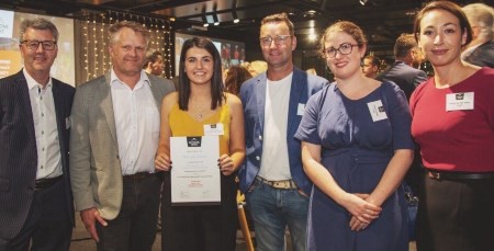 Hannah Wilson, centre, with members of the Property institute of New Zealand when given her scholarship.