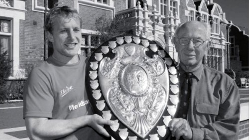Rugby's Ranfurly Shield in the hands of current Canterbury halfback Ben Hurst (left) and former Canterbury coach Sir James Stewart (right) 