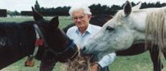 Emeritus Professor of Veterinary Science Cliff Irvine, with equine friends, in 2003.