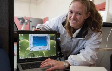 Catherine Lizamore monitoring a participant's blood oxygen levels and heart rate during the IHE session.